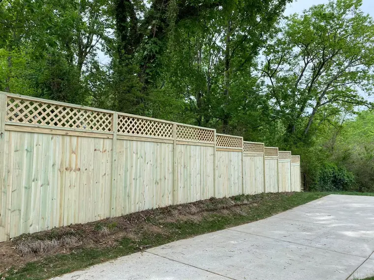 Lattice-top fence along a street