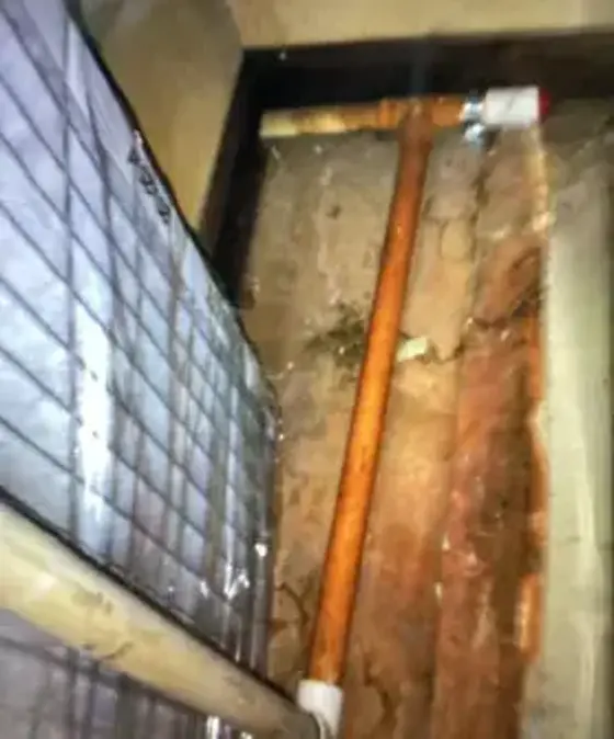 Copper pipe under tile after a slab leak repair