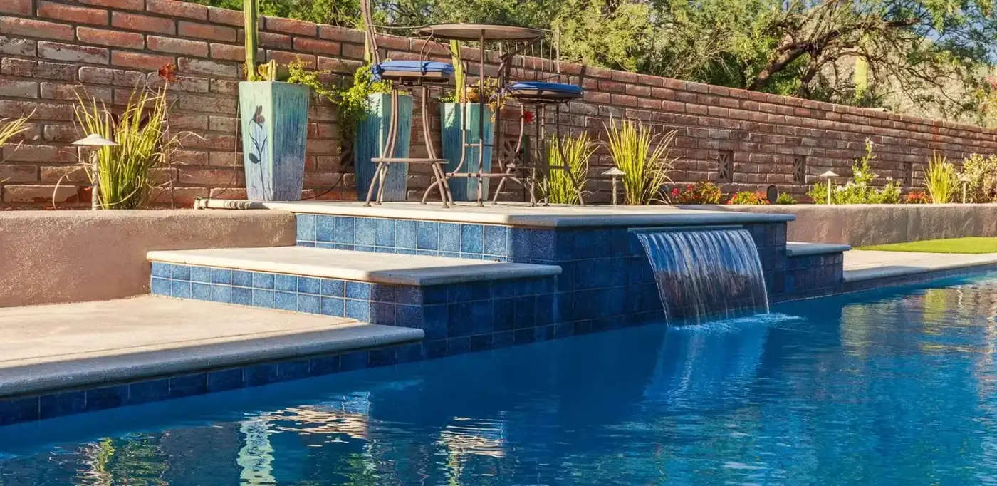 Pool waterfall spillway